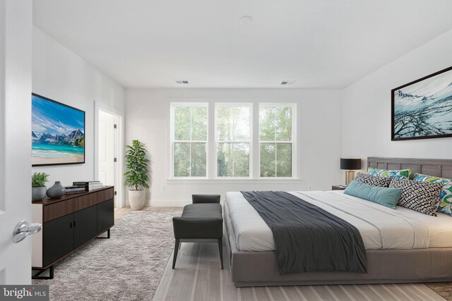 bedroom with light hardwood / wood-style flooring