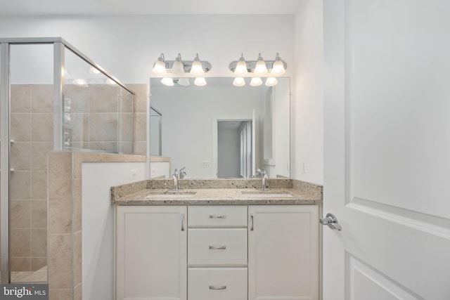 bathroom featuring vanity and a tile shower