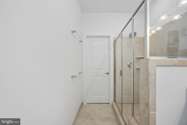 bathroom featuring tile patterned floors and an enclosed shower