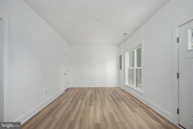 empty room with light hardwood / wood-style floors