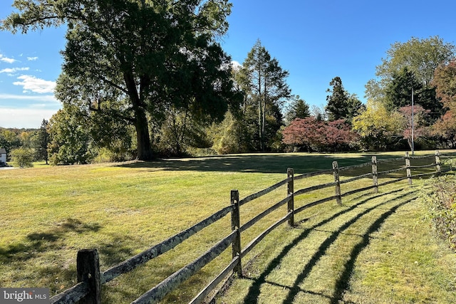 view of yard with a rural view