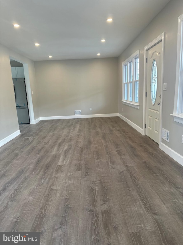 entrance foyer with dark hardwood / wood-style flooring