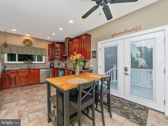 kitchen featuring appliances with stainless steel finishes, sink, decorative backsplash, and french doors