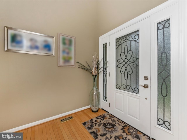 entrance foyer with hardwood / wood-style flooring