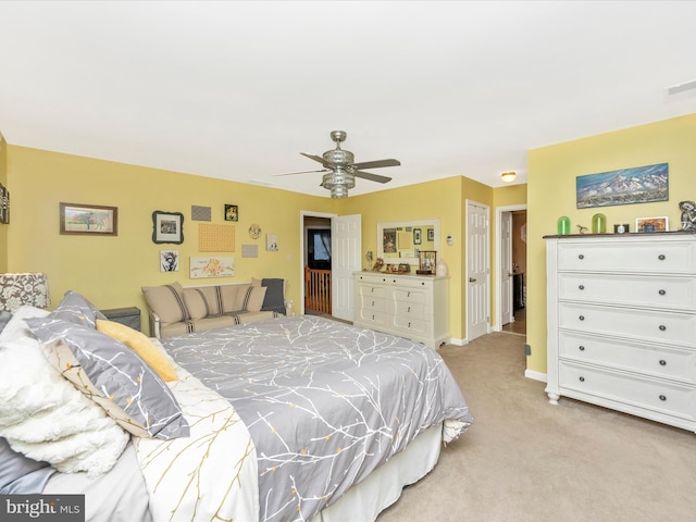 bedroom featuring ceiling fan and light carpet