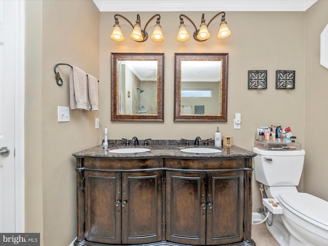 bathroom featuring vanity, crown molding, and toilet