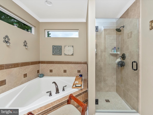 bathroom with crown molding and shower with separate bathtub