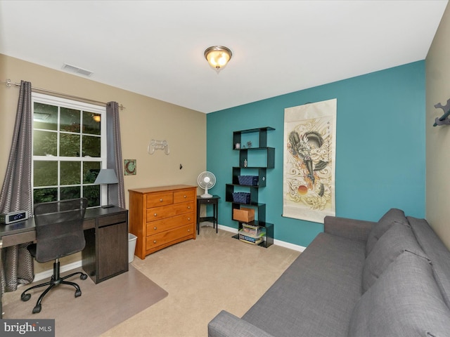 office area featuring light colored carpet