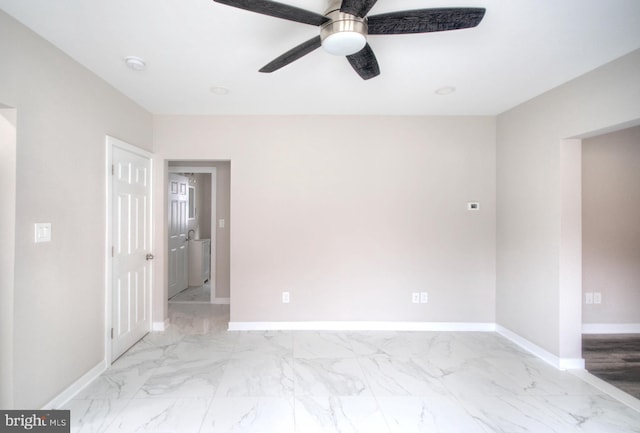 unfurnished room with ceiling fan