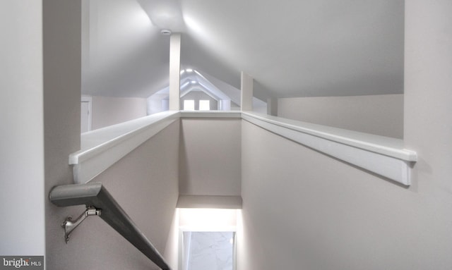 stairway with lofted ceiling