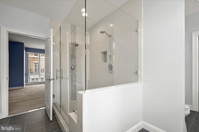 bathroom featuring an enclosed shower, tile patterned floors, and toilet