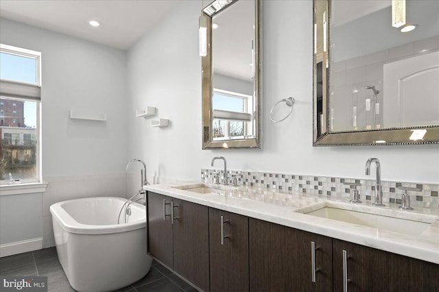 bathroom with tile patterned flooring, vanity, and independent shower and bath