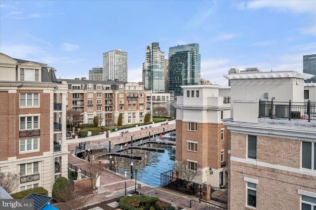 property's view of city featuring a water view