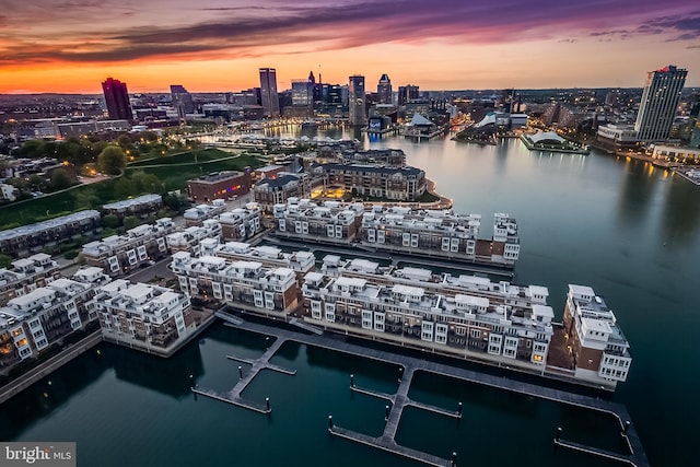 aerial view at dusk with a water view