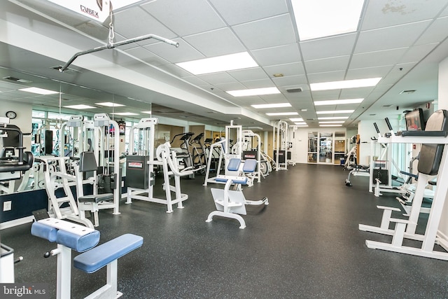 workout area featuring a drop ceiling