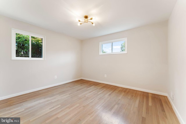 unfurnished room featuring light wood-type flooring