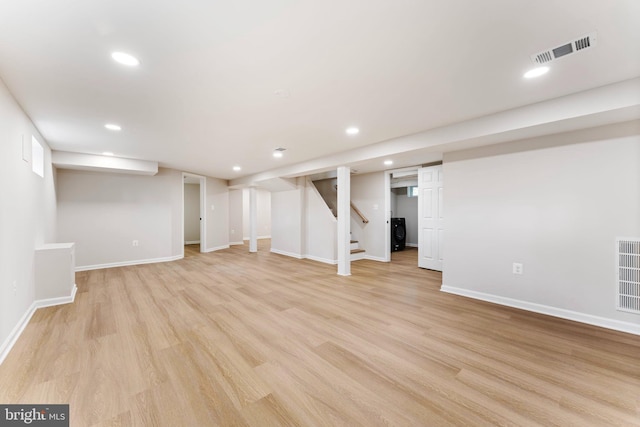 basement featuring light wood-type flooring