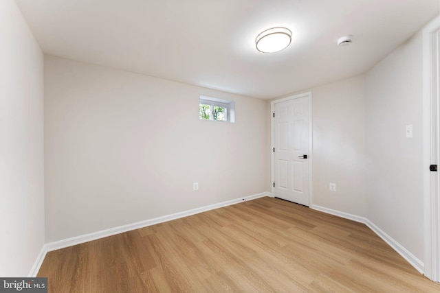 spare room featuring light hardwood / wood-style floors