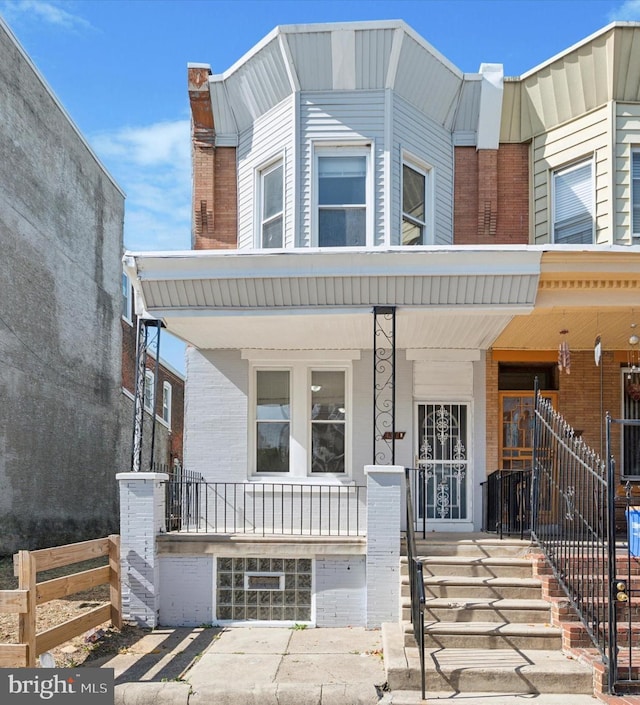 townhome / multi-family property with covered porch