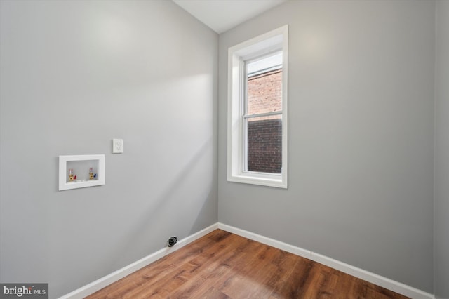 laundry area featuring washer hookup and hardwood / wood-style floors