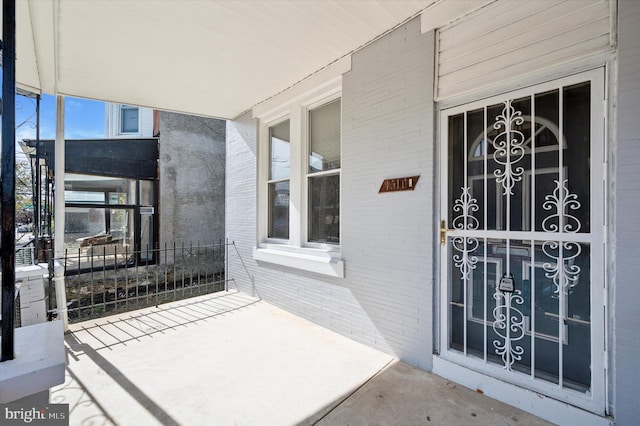 property entrance featuring covered porch