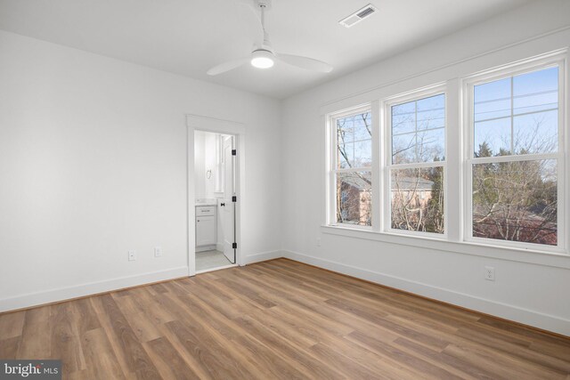 empty room featuring ceiling fan and wood-type flooring