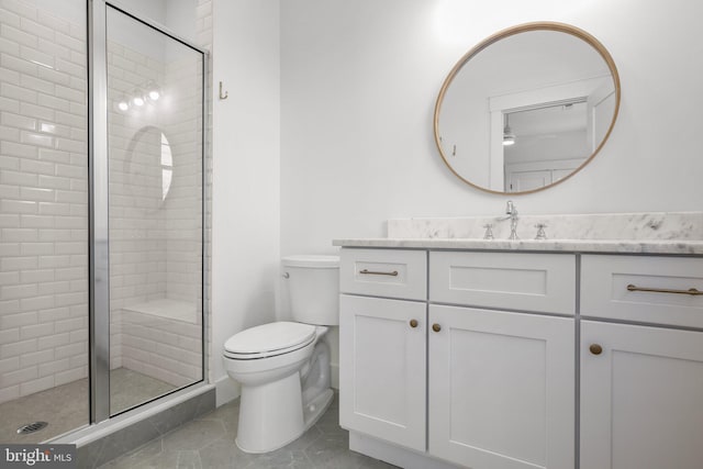 bathroom featuring tile patterned flooring, vanity, toilet, and walk in shower