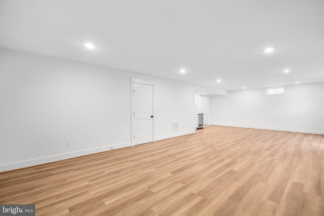 basement featuring light hardwood / wood-style floors