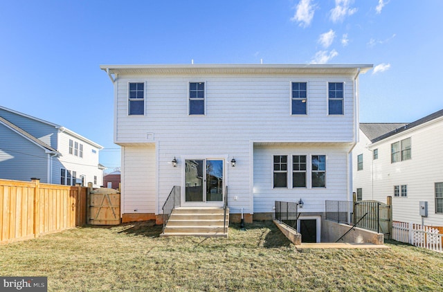 rear view of property with a yard