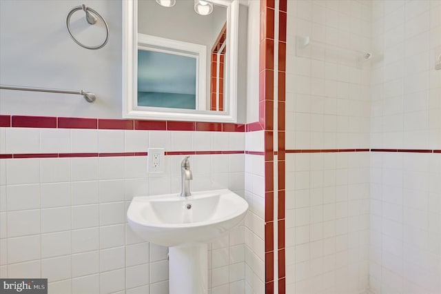 bathroom with tile walls