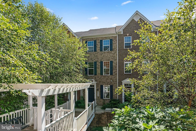 view of front of house with a pergola