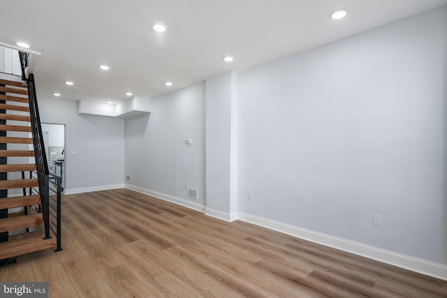 basement featuring light hardwood / wood-style flooring