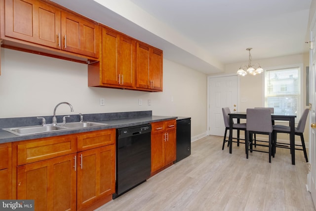 1121 Ward St, Baltimore, MD 21230 - kitchen featuring black dishwasher, brown cabinets, dark countertops, and a chandelier