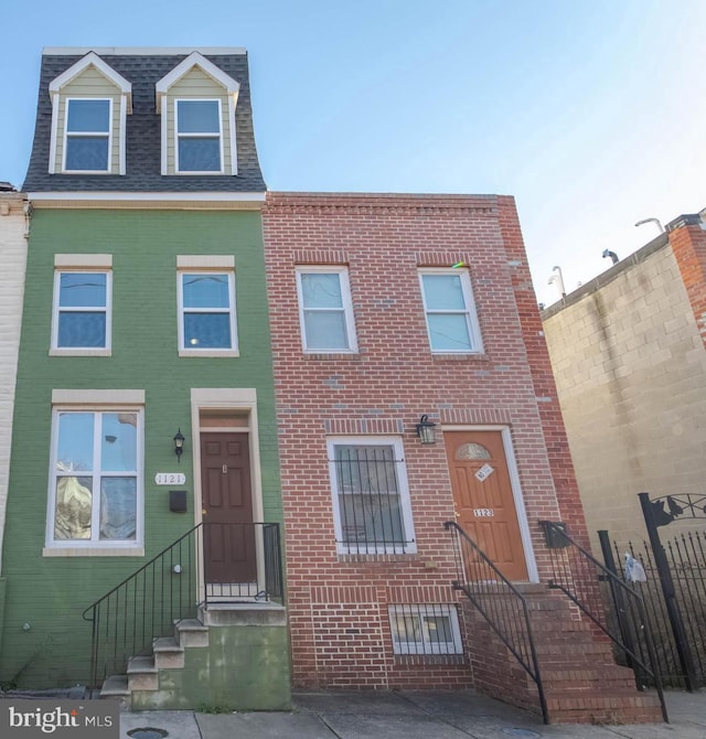 1121 Ward St, Baltimore, MD 21230 - townhome / multi-family property with brick siding and roof with shingles