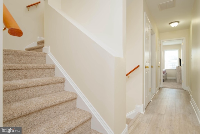 1121 Ward St, Baltimore, MD 21230 - stairway featuring wood finished floors and baseboards