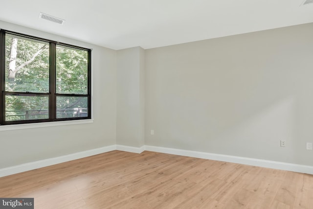 spare room featuring light hardwood / wood-style flooring