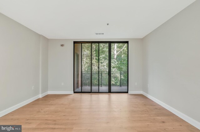 spare room with light wood-type flooring