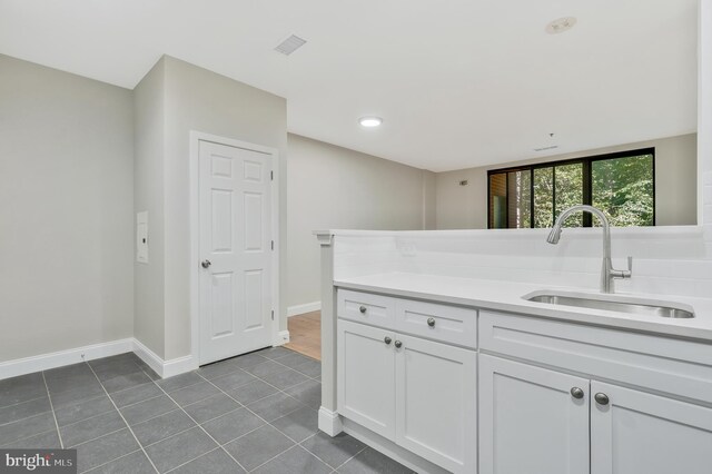 bathroom with vanity and tile patterned flooring