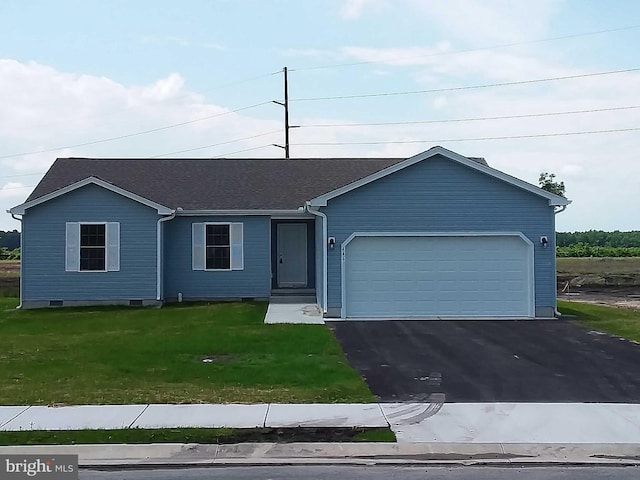 view of front facade with a garage and a front lawn