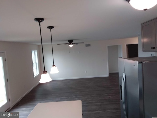 interior space featuring ceiling fan and dark hardwood / wood-style flooring