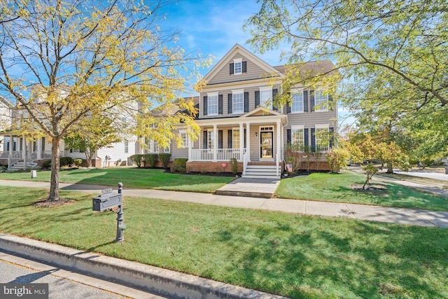 view of front of house with a front lawn and a porch