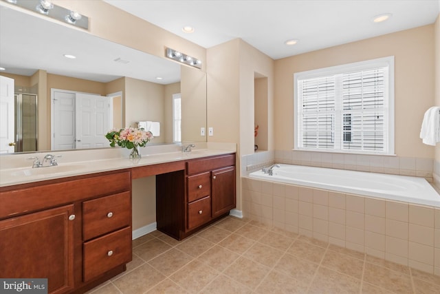 bathroom with vanity, plus walk in shower, and tile patterned floors