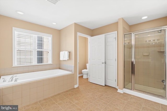 bathroom with shower with separate bathtub, tile patterned flooring, and toilet