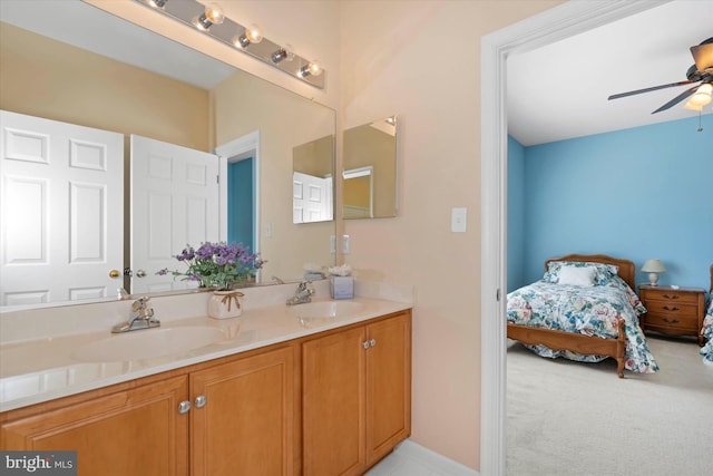 bathroom featuring ceiling fan and vanity