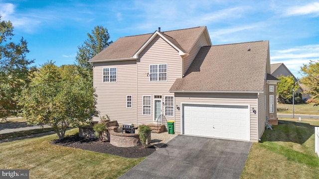 view of front of home featuring a front lawn and a garage