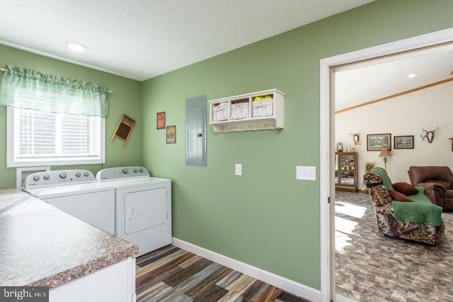 laundry area featuring electric panel and washing machine and clothes dryer