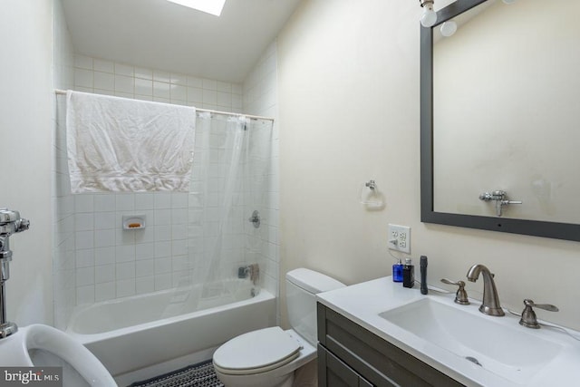 full bathroom with vanity, shower / tub combo, and toilet