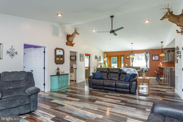 living room with french doors, dark hardwood / wood-style floors, high vaulted ceiling, and ceiling fan