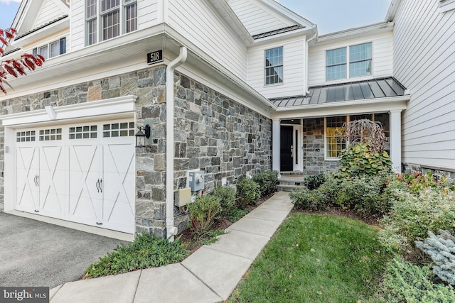 doorway to property featuring a garage