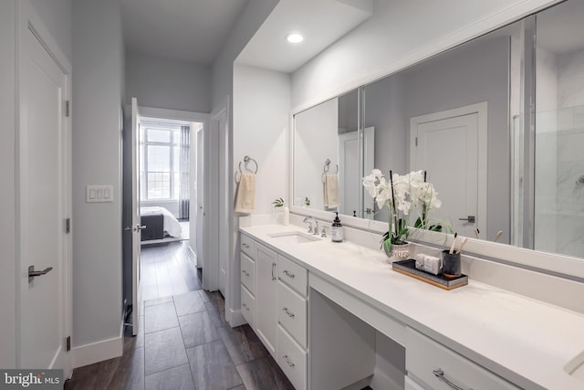 bathroom with vanity and wood-type flooring